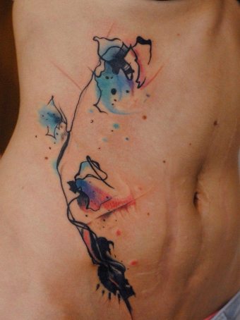 Tatueringar på magen: Funktioner av proceduren och symbolerna på ritningarna